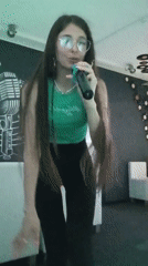 Woman enjoys karaoke session in Chaikovsky music room