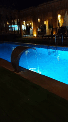 Resort pool glowing at night in Manavgat, Turkey