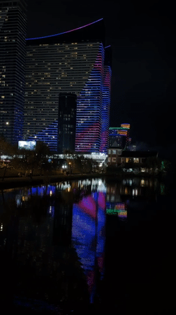 Batumi's illuminated Marriott tower reflected in a still lake