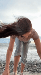 Woman enjoys beach moments with dog in Sochi