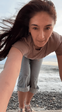 Woman enjoys beach moments with dog in Sochi