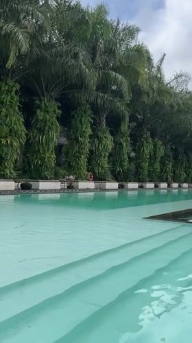 Resort pool filmed in early morning Ubud, Indonesia