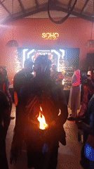 Fire performers entertain crowds at nighttime gathering in Nigeria