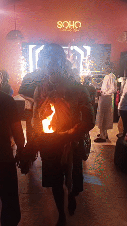 Fire performers entertain crowds at nighttime gathering in Nigeria