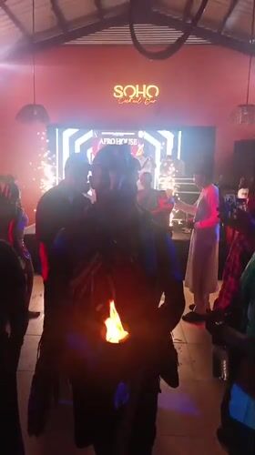 Fire performers entertain crowds at nighttime gathering in Nigeria