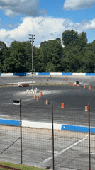 Cars drifting cone courses at a Williamston track event