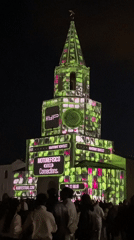 Colorful light display illuminates tower in Kazan plaza