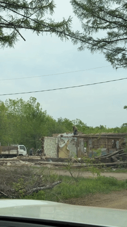 Man dismantles building remains in Birobidzhan, Russia