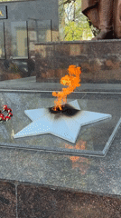 War memorial visited, child walks plaza in Zav'yalovo