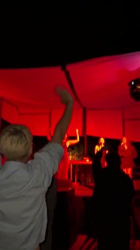 Live outdoor concert under lit canopy in Asureti, Georgia