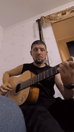 Acoustic guitar session filmed indoors in Qarağandı, Kazakhstan