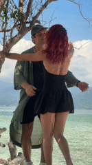 Couple shares intimate beach moment in Indonesia dawn hours