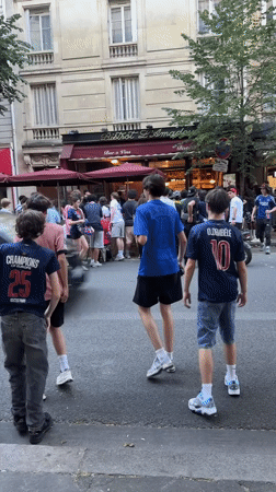 Soccer fans queue at Paris bistro