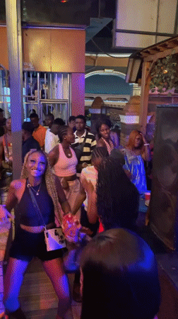 Nightclub scene with live music and dancing in Obosi