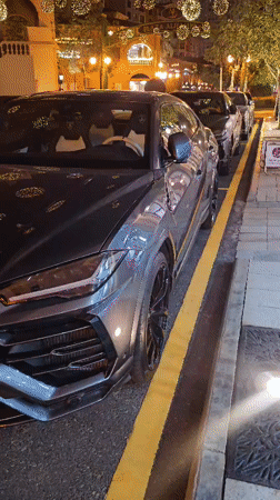 Luxury cars spotted on Doha street during evening hours