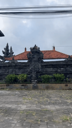 Drive through traditional Balinese village Sigaran captures local landmarks