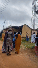 Community gathering in Rafin Par, Nigeria, traditional dress throughout