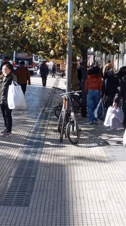 Busy street scene captured in Buenos Aires afternoon