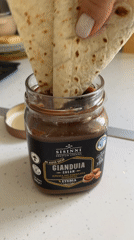 Person prepares chocolate tortilla snack in Limassol kitchen