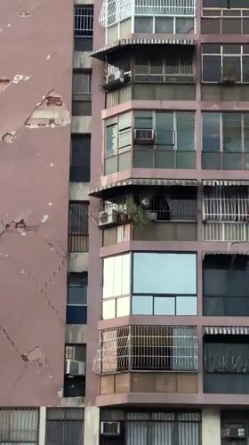 Residential towers line a marked street in Maracay, Venezuela