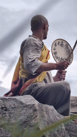 Monk with drum, mountain views, and daily life in Manali