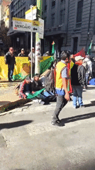 Street demonstration with flags, banner observed in La Paz
