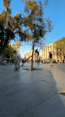 Skateboarder performs trick in Barcelona public space