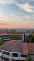 City sunset captured from elevated position shows dramatic sky