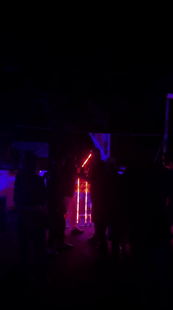 Outdoor party with colored lighting observed in Beit Uziel