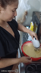 Late-night baking session captured alongside Caracas cityscape views