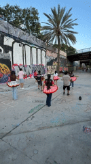 Young dancers practice routines in Barcelona's graffiti-covered streets