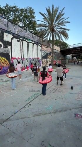 Young dancers practice routines in Barcelona's graffiti-covered streets