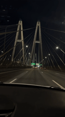 Nighttime bridge crossing captured on video in Novosaratovka, Russia