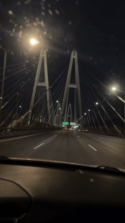 Nighttime bridge crossing captured on video in Novosaratovka, Russia