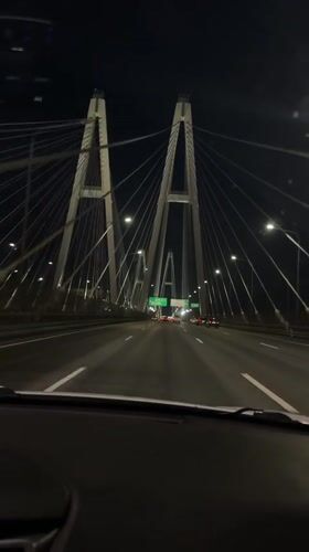 Nighttime bridge crossing captured on video in Novosaratovka, Russia