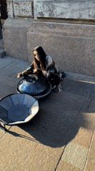 Street musician performs handpan music in busy Saint Petersburg