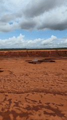 Dry red riverbed with puddles documented in Mui Ne