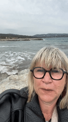 Woman photographed on rocky shore in Cavalaire-sur-Mer