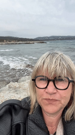 Woman photographed on rocky shore in Cavalaire-sur-Mer