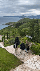 Family walks down stone steps in Montenegro village