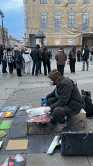Street artist draws crowds during outdoor art demonstration in Saint Petersburg
