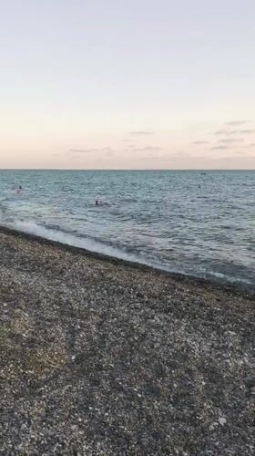 Late afternoon at Sochi's Black Sea pebble beach, sunset approaching