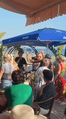 Beachside cafe memories: music, dancing, cats, and daily moments