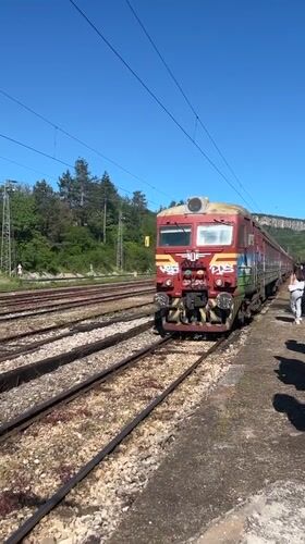 Graffiti-covered train arrives at Bulgarian station during morning hours
