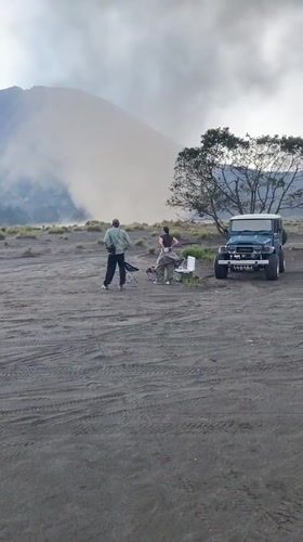 Couple with jeep observed near smoking mountain in Tosari