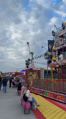 Carnival operates in Lille with thrill rides under cloudy skies