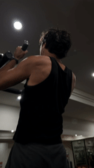 Man performs pull-ups at Denpasar gym early morning