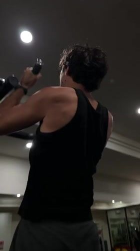 Man performs pull-ups at Denpasar gym early morning