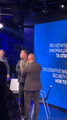 Three men filmed for media presentation in Kyiv