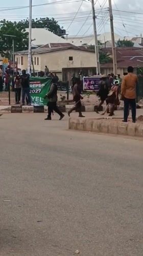 Horses, crowds, and street activity in Bukuru, Nigeria